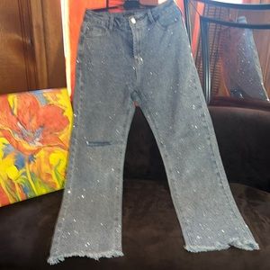 Hot and delicious blue jeans rhinestone encrusted with distressed hem. Sz Large